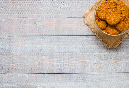 Healthy morning breakfast with cereal biscuits, over a wooden table background.の写真素材