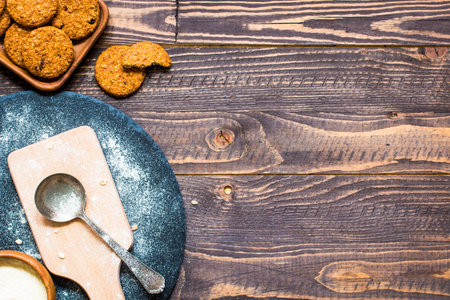 Healthy morning breakfast with cereal biscuits, dried cranberries and grapes over a wooden table...