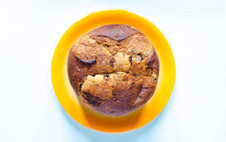 Panettone with chocolate and Christmas decoration on a white backgroundの写真素材