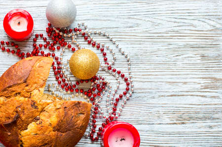 Panettone with chocolate and Christmas decoration on a white backgroundの写真素材