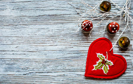 Red heart with candle copyspace for Valentines or Christmas on wooden backgroundの写真素材