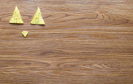 Mexican nachos chips with spicy tomato sauce on wooden backgroundの写真素材