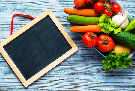 Healthy food and copy space, fresh vegetables, organic on a wooden backgroundの写真素材