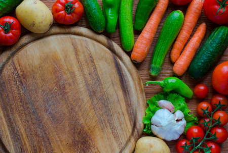 Healthy food and copy space, fresh vegetables, organic on a wooden backgroundの写真素材