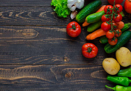Healthy food and copy space, fresh vegetables, organic on a wooden backgroundの写真素材