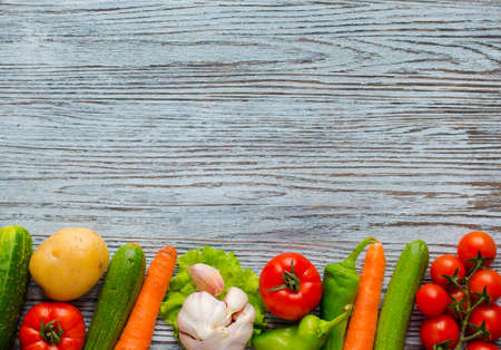 Healthy food and copy space, fresh vegetables, organic on a wooden backgroundの写真素材