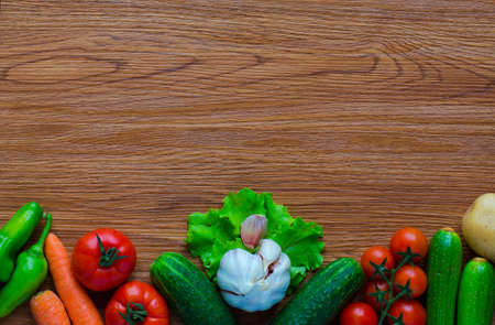 Healthy food and copy space, fresh vegetables, organic on a wooden backgroundの写真素材