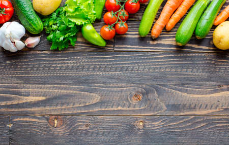 Healthy food and copy space, fresh vegetables, organic on a wooden backgroundの写真素材