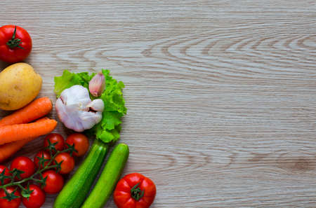 Healthy food and copy space, fresh vegetables, organic on a wooden backgroundの写真素材