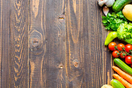 Healthy food and copy space, fresh vegetables, organic on a wooden backgroundの写真素材