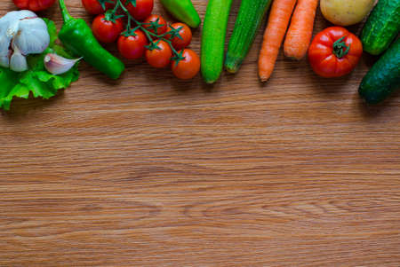 Healthy food and copy space, fresh vegetables, organic on a wooden backgroundの写真素材