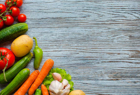 Healthy food and copy space, fresh vegetables, organic on a wooden backgroundの写真素材