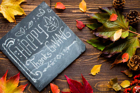 Thanksgiving day, autumn leaves background and text, on different rustic woodenの写真素材