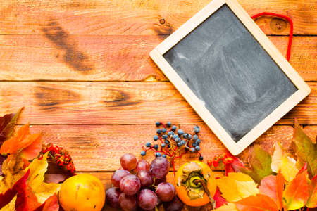 Thanksgiving day, autumn leaves background and text, on different rustic woodenの写真素材