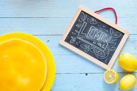 Homemade lemon cheesecake, very simple delicious cake, on a wooden backgroundの写真素材