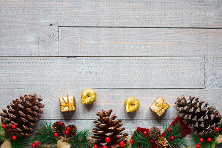 Christmas collection, gifts and decorative ornaments, over wooden background