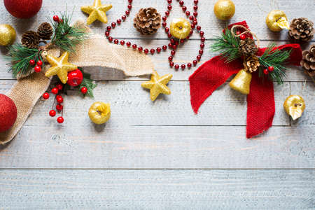 Christmas collection, gifts and decorative ornaments, over wooden backgroundの写真素材