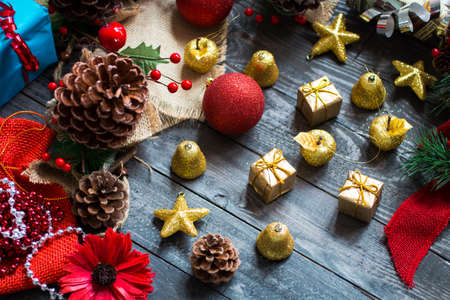 Christmas collection, gifts and decorative ornaments, over wooden backgroundの写真素材