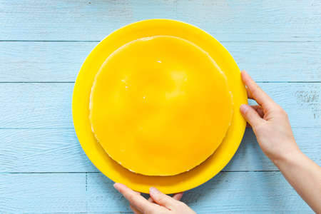 Homemade lemon cheesecake, very simple delicious cake, on a wooden backgroundの写真素材