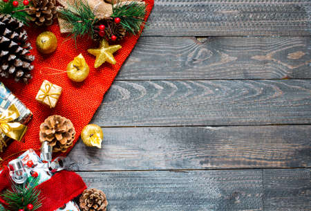 Christmas collection, gifts and decorative ornaments, over wooden backgroundの写真素材