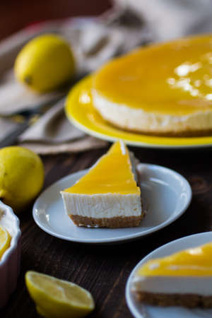Homemade lemon cheesecake, very simple delicious cake, on a wooden backgroundの写真素材