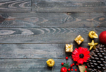 Christmas collection, gifts and decorative ornaments, over wooden backgroundの写真素材