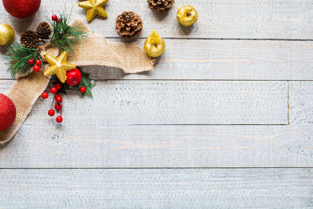 Christmas collection, gifts and decorative ornaments, over wooden backgroundの写真素材