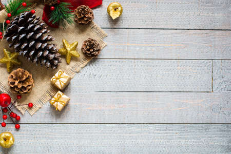 Christmas collection, gifts and decorative ornaments, over wooden backgroundの写真素材