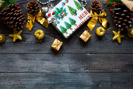 Christmas collection, gifts and decorative ornaments, over wooden backgroundの写真素材
