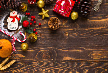 Mini panettone with fruits and Christmas decoration, on different wood backgroundの写真素材