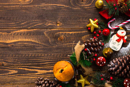 Mini panettone with fruits and Christmas decoration, on different wood backgroundの写真素材