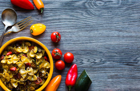 Italian pasta with vegetables: zucchini, tomatoes, peppers and potatoの写真素材