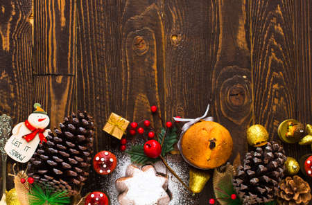 Mini panettone with fruits and Christmas decoration, on different wood backgroundの写真素材