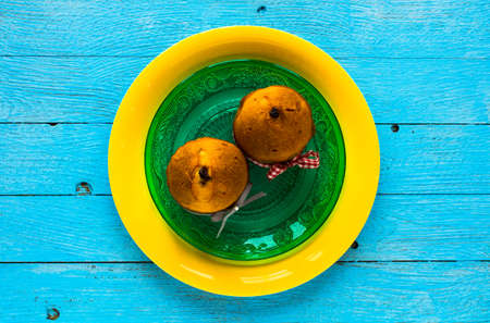 Mini panettone with fruits and Christmas decoration, on different wood backgroundの写真素材