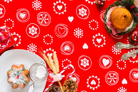 Mini panettone with fruits and Christmas decoration, on different wood backgroundの写真素材