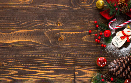 Mini panettone with fruits and Christmas decoration, on different wood backgroundの写真素材