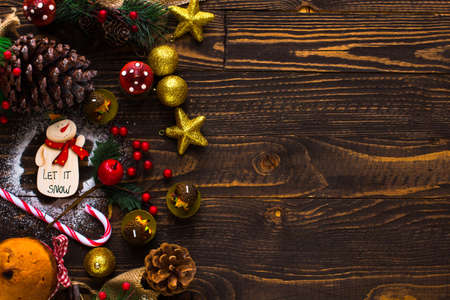 Mini panettone with fruits and Christmas decoration, on different wood backgroundの写真素材