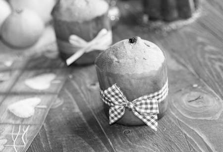 Mini panettone with fruits and Christmas decoration, on different wood backgroundの写真素材
