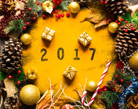 Christmas collection, gifts and decorative ornaments, over wooden backgroundの写真素材