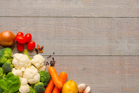 Healthy food and copy space, fresh vegetables, organic on a wooden backgroundの写真素材