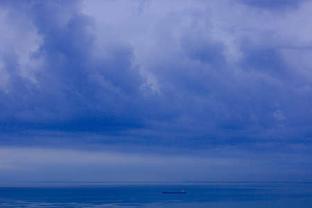 Sea horizon, bad weather seascape with cloudy skyの写真素材