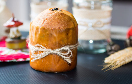 Mini panettone with Christmas decoration, on different wood backgroundの写真素材