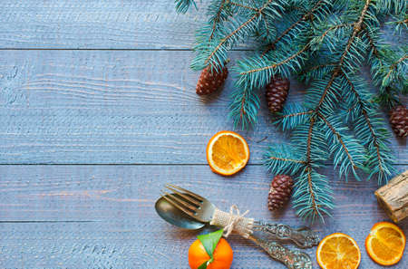 Christmas holiday background with ornaments like cookies and oranges on rustic wooden background.の写真素材