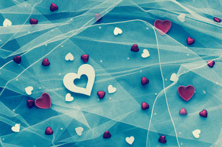 Valentine's Day background, with hearts and various romentic elements over an elegant vintage backgroundの写真素材