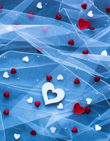 Valentine's Day background, with hearts and various romentic elements over an elegant vintage backgroundの写真素材