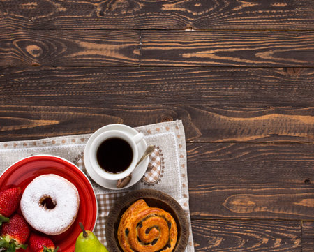 Top view of Healthy Sandwich toast with coffee,donuts, with fruits on a wooden background