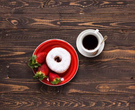 Top view of Healthy Sandwich toast with coffee,donuts, with fruits on a wooden backgroundの写真素材