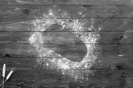 Fresh homemade bread, on wooden background. Top viewの写真素材