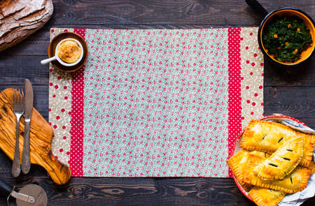 Delicious pie with spinach, made at home, on a wooden background, top viewの写真素材