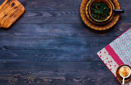 Delicious pie with spinach, made at home, on a wooden background, top viewの写真素材